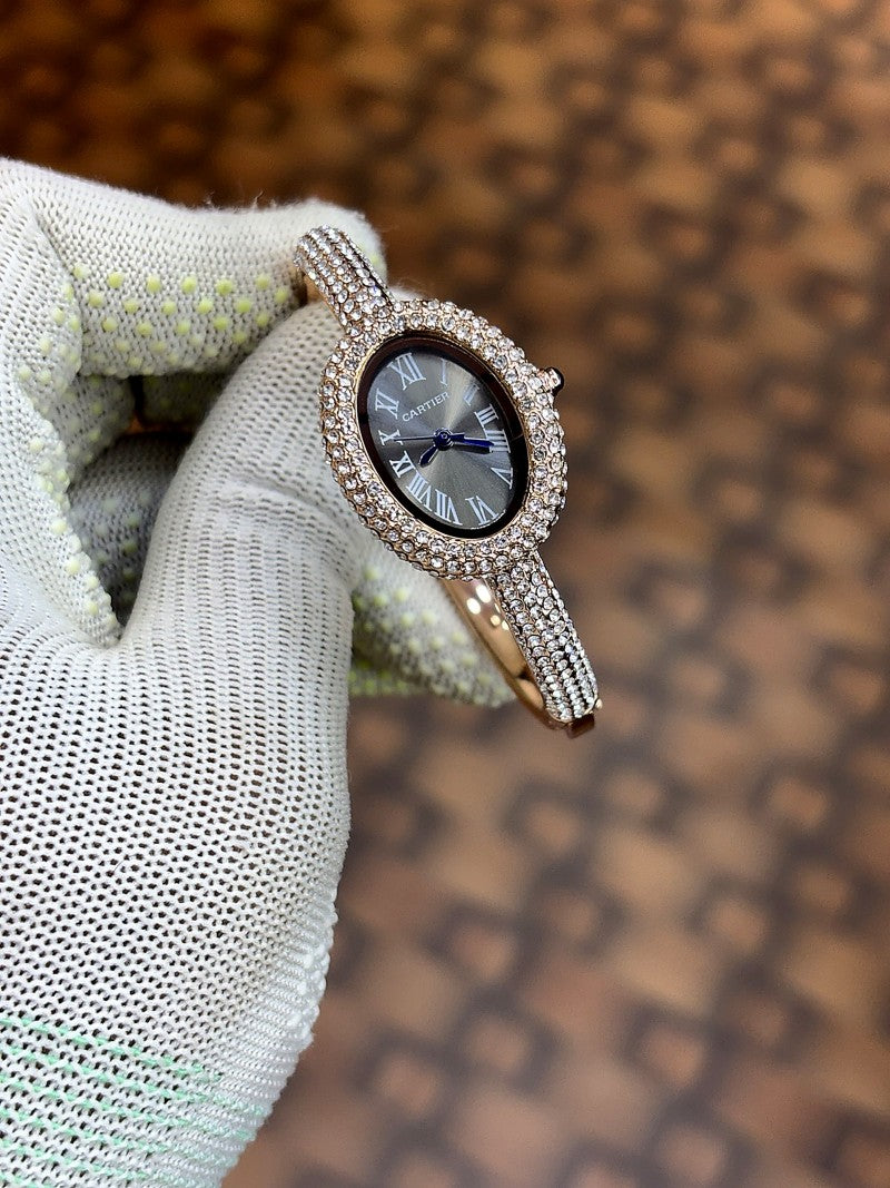 Cartier Baignoire watch in 18k rose gold with a diamond set bezel and bracelet