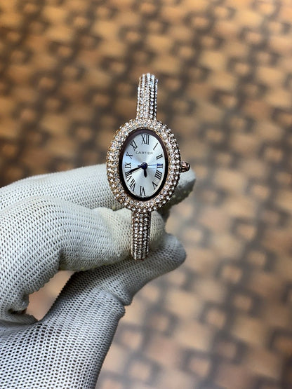 Cartier Baignoire watch in 18k rose gold with a diamond set bezel and bracelet