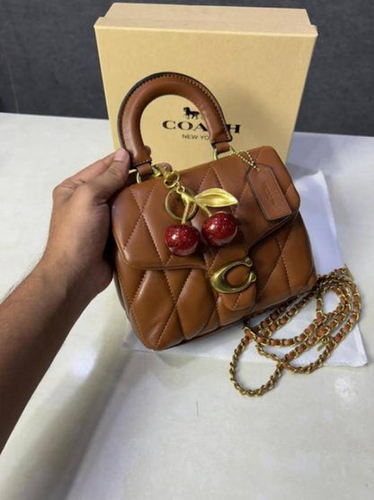 Coac tabby top handle quilted leather with cherry charm with box 881