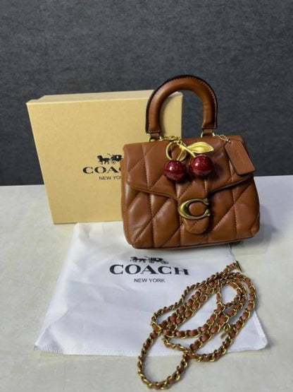 Coac tabby top handle quilted leather with cherry charm with box 881