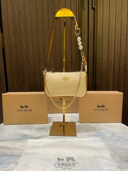 coac Nolita shoulder bag with pearl charm with box etc...980